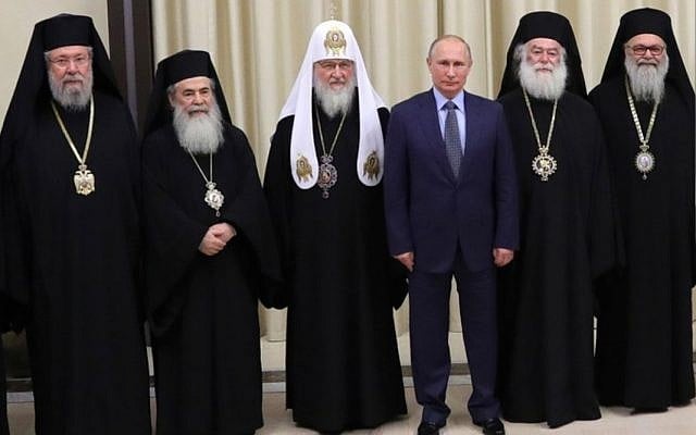 Theophilus lll, Greek Orthodox Patriarch of Jerusalem (second from left), pictured with (from left) the Archbishop of Cyprus, Patriarch Kirill of Moscow, President Vladimir Putin, the Patriarch of Alexandria, and the Patriarch of Antioch, on December 5, 2017. (Courtesy) Theophilus lll, Greek Orthodox Patriarch of Jerusalem (second from left), pictured with (from left) the Archbishop of Cyprus, Patriarch Kirill of Moscow, President Vladimir Putin, the Patriarch of Alexandria, and the Patriarch of Antioch, on December 5, 2017. (Courtesy)