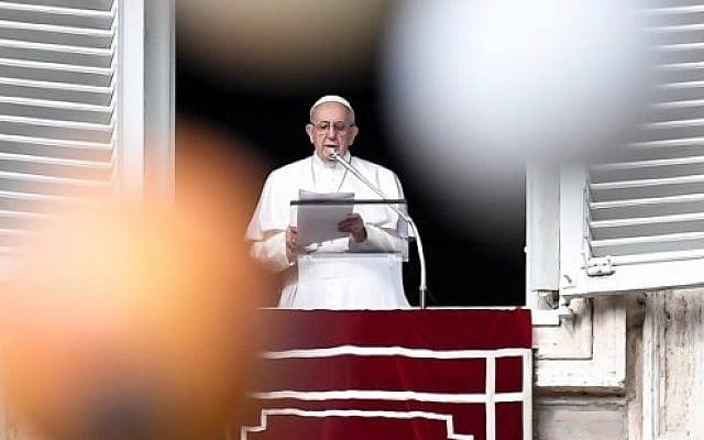 Pope Francis is pictured through the branches of a Christmas tree as he addresses the crowd from the Apostolic Palace overlooking St Peter's square during the Angelus prayer on December 10, 2017 at the Vatican. (AFP PHOTO / Andreas SOLARO) Pope Francis is pictured through the branches of a Christmas tree as he addresses the crowd from the Apostolic Palace overlooking St Peter's square during the Angelus prayer on December 10, 2017 at the Vatican. (AFP PHOTO / Andreas SOLARO)