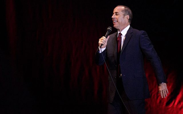 Jerry Seinfeld performing at the Menora Mivtachim Arena in Tel Aviv, Dec. 19, 2015. (Guy Prives/Redferns/Getty Images via JTA) Jerry Seinfeld performing at the Menora Mivtachim Arena in Tel Aviv, Dec. 19, 2015. (Guy Prives/Redferns/Getty Images via JTA)