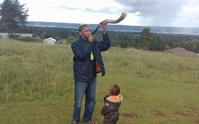 Yehudah Kimani blows a shofar on December 13, 2017, in his home of Kasuku in the highlands of Kenya. (courtesy Yehudah Kimani/Facebook) Yehudah Kimani blows a shofar on December 13, 2017, in his home of Kasuku in the highlands of Kenya. (courtesy Yehudah Kimani/Facebook)
