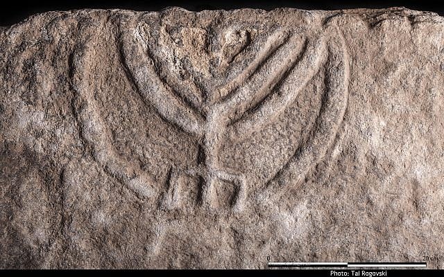 Menorah carved into the door of a Jewish tomb, circa 150-350 CE found in Tiberius. (Tal Rogoveski)