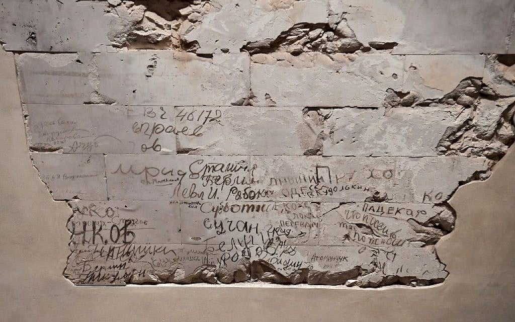 Picture taken on December 12, 2017 shows graffitis left over inside the Reichstag parliament building in Berlin. (AFP PHOTO / John MACDOUGALL)