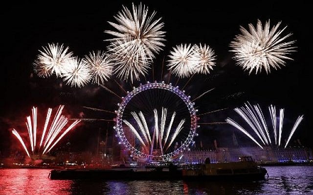 Fireworks explode around the London Eye during New Year's celebrations in central London just after midnight on January 1, 2018. (AFP PHOTO / Tolga AKMEN) Fireworks explode around the London Eye during New Year's celebrations in central London just after midnight on January 1, 2018. (AFP PHOTO / Tolga AKMEN)