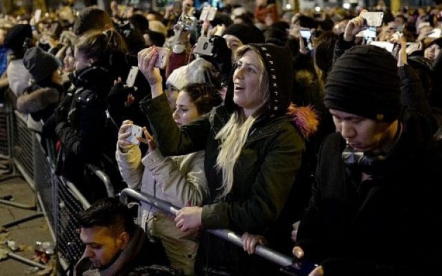 A reveller takes a selfie photograph during New Year's celebrations in central London just after midnight on January 1, 2018. (AFP PHOTO / Tolga AKMEN) A reveller takes a selfie photograph during New Year's celebrations in central London just after midnight on January 1, 2018. (AFP PHOTO / Tolga AKMEN)