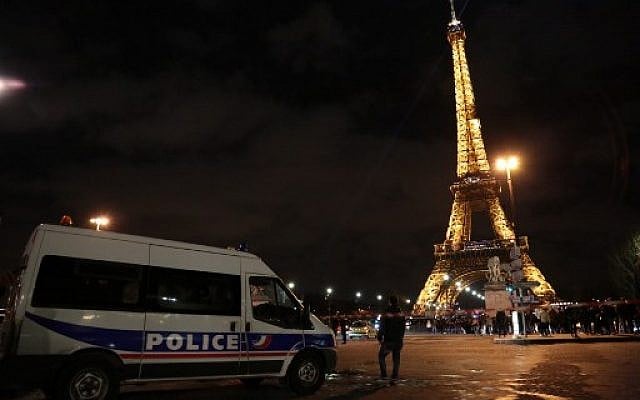 First responders stand on a road near the Eiffel Tower during New Year's celebrations in Paris on December 31, 2017. (AFP PHOTO / Zakaria ABDELKAFI) First responders stand on a road near the Eiffel Tower during New Year's celebrations in Paris on December 31, 2017. (AFP PHOTO / Zakaria ABDELKAFI)