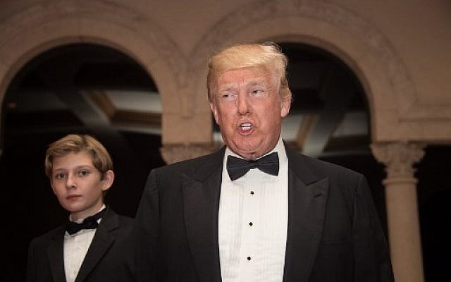 US President Donald Trump and son Barron arrive for a new year's party at Trump's Mar-a-Lago resort in Palm Beach, Florida, on December 31, 2017. (AFP PHOTO/NICHOLAS KAMM) US President Donald Trump and son Barron arrive for a new year's party at Trump's Mar-a-Lago resort in Palm Beach, Florida, on December 31, 2017. (AFP PHOTO/NICHOLAS KAMM)