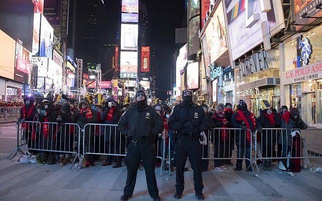 NYPD officers stand guard during New Year's Eve in Times Square activities on December 31, 2017 in New York. AFP/Don Emmert)