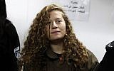 Palestinian teenager Ahed Tamimi, center, attends a hearing at the Ofer military court in the West Bank on January 1, 2018. (AFP Photo/Ahmad Gharabli)