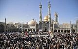 Illustrative: Pro-government demonstrators gather at the Massoumeh shrine in Iran's holy city of Qom on January 3, 2018. (AFP PHOTO / Mohammad ALI MARIZAD)