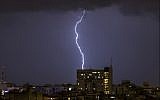 Illustrative: Lightning is seen above the coastal city of Netanya on January 4, 2018, as the worst storm of the winter hits Israel. (AFP Photo/Jack Guez)