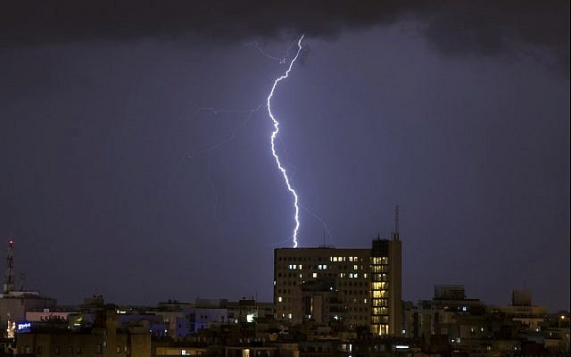 Illustrative: Lightning is seen above the coastal city of Netanya on January 4, 2018, as the worst storm of the winter hits Israel. (AFP Photo/Jack Guez) Illustrative: Lightning is seen above the coastal city of Netanya on January 4, 2018, as the worst storm of the winter hits Israel. (AFP Photo/Jack Guez)