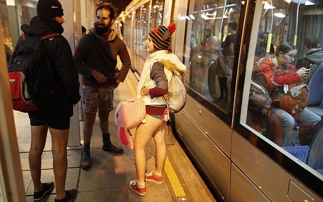 People taking part in the annual international "No Pants Subway Ride" day travel on the Jerusalem light train on January 7, 2018. (AFP PHOTO / AHMAD GHARABLI) People taking part in the annual international "No Pants Subway Ride" day travel on the Jerusalem light train on January 7, 2018. (AFP PHOTO / AHMAD GHARABLI)