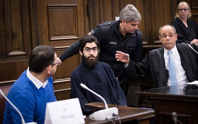 Ahmad Alhaw, a 26-year-old Palestinian man, waits in a courtroom next to his lawyer Christoph Burchard (R) and a translator on January 12, 2018 in Hamburg. (AFP/Pool/Christian Charisius) Ahmad Alhaw, a 26-year-old Palestinian man, waits in a courtroom next to his lawyer Christoph Burchard (R) and a translator on January 12, 2018 in Hamburg. (AFP/Pool/Christian Charisius)