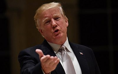 US President Donald Trump speaks to reporters at Trump International Golf Club in West Palm Beach on January 14, 2018. (AFP Photo/Nicholas Kamm)
