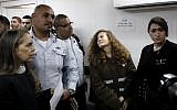 Sixteen-year-old Palestinian Ahed Tamimi (2nd right) stands for a hearing in the Israeli military court at Ofer military prison in the West Bank, on January 15, 2018. (AFP PHOTO / THOMAS COEX)