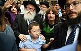 Moshe Holtzberg, son of slain Rabbi Gavriel Holtzberg who was killed along with his wife in the November 26, 2008 attacks, reacts as he arrives with his grandparents at the Chabad house in Mumbai on January 16, 2018. (AFP Photo/Punit Paranjpe)