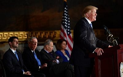 US President Donald Trump  speaks during a ceremony to present the Congressional Gold Medal to former Republican US Senate Majority Leader Bob Dole, at the US Capitol on January 17, 2018 in Washington, DC. (AFP PHOTO / Nicholas Kamm)