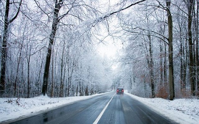 A car driving on a road in a snow-covered landscape near Warin, in northern Germany, as the traffic is disturbed by heavy snow falls in the region, January 18,
2018. (AFP Photo/dpa/Jens Büttner/Germany OUT) A car driving on a road in a snow-covered landscape near Warin, in northern Germany, as the traffic is disturbed by heavy snow falls in the region, January 18,
2018. (AFP Photo/dpa/Jens Büttner/Germany OUT)
