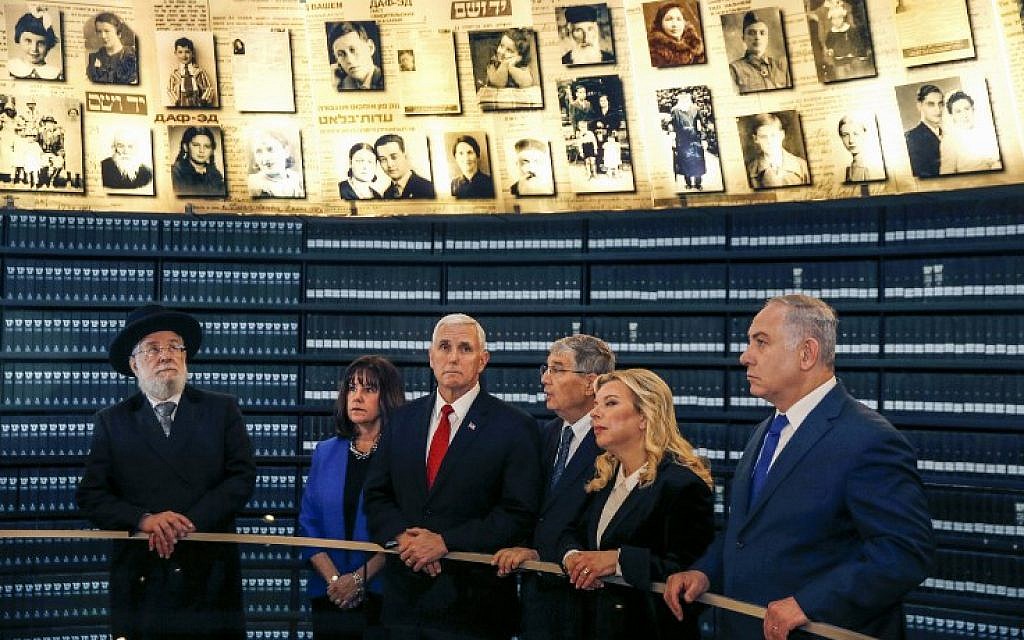 Illustrative: Yad Vashem Director Avner Shalev, third from right, tours the museum's Hall of Names with US Vice President Mike Pence, center, and his wife Karen, second from left, Yad Vashem Chairman Council Rabbi Israel Meir Lau, left, Prime Minister Benjamin Netanyahu, right, and wife Sara Netanyahu, second from right, in Jerusalem, January 23, 2018. (AFP PHOTO / POOL / RONEN ZVULUN)
