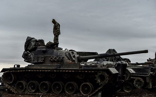 A Turkish soldier stands on a tank near the Syrian border at Hassa, in Hatay province on January 24, 2018, as part of the operation 'Olive Branch' against Kurdish fighters (AFP PHOTO / OZAN KOSE) A Turkish soldier stands on a tank near the Syrian border at Hassa, in Hatay province on January 24, 2018, as part of the operation 'Olive Branch' against Kurdish fighters (AFP PHOTO / OZAN KOSE)