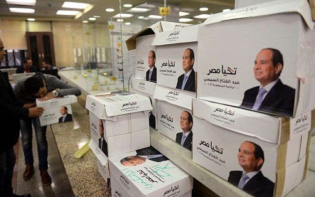 Members of Egyptian President Abdel Fattah el-Sissi's campaign staff stand next to boxes containing the signatures of support needed to register for the elections, at the National Election Authority in Cairo, on January 24, 2018. (AFP Photo/Mohamed El-Shahed) Members of Egyptian President Abdel Fattah el-Sissi's campaign staff stand next to boxes containing the signatures of support needed to register for the elections, at the National Election Authority in Cairo, on January 24, 2018. (AFP Photo/Mohamed El-Shahed)
