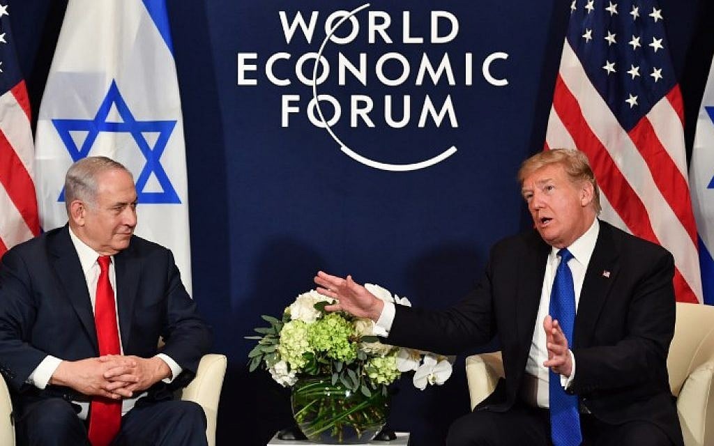 US President Donald Trump (right) speaks with Israel's Prime Minister Benjamin Netanyahu during a bilateral meeting on the sidelines of the World Economic Forum (WEF) annual meeting in Davos, Switzerland, on January 25, 2018. (AFP PHOTO / Nicholas Kamm) US President Donald Trump (right) speaks with Israel's Prime Minister Benjamin Netanyahu during a bilateral meeting on the sidelines of the World Economic Forum (WEF) annual meeting in Davos, Switzerland, on January 25, 2018. (AFP PHOTO / Nicholas Kamm)