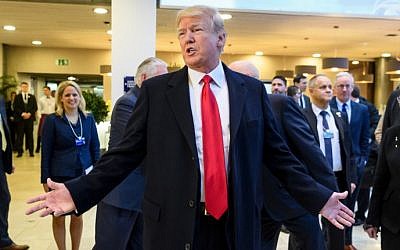 US President Donald Trump answers to journalists upon his arrival to address the World Economic Forum (WEF) annual meeting on January 26, 2018 in Davos, eastern Switzerland. (AFP PHOTO / Fabrice COFFRINI) US President Donald Trump answers to journalists upon his arrival to address the World Economic Forum (WEF) annual meeting on January 26, 2018 in Davos, eastern Switzerland. (AFP PHOTO / Fabrice COFFRINI)