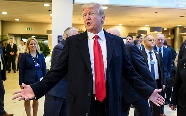 US President Donald Trump answers to journalists upon his arrival to address the World Economic Forum (WEF) annual meeting on January 26, 2018 in Davos, eastern Switzerland. (AFP PHOTO / Fabrice COFFRINI) US President Donald Trump answers to journalists upon his arrival to address the World Economic Forum (WEF) annual meeting on January 26, 2018 in Davos, eastern Switzerland. (AFP PHOTO / Fabrice COFFRINI)