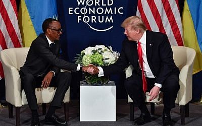 US President Donald Trump (R) shakes hands with Rwandan President President Paul Kagame during a bilateral meeting on the sideline of the annual meeting of the World Economic Forum (WEF) on January 26, 2018 in Davos, eastern Switzerland. ( AFP PHOTO / Nicholas Kamm)