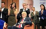 Pro-Russian incumbent Milos Zeman (seated) is applauded as he celebrates his victory with his staff members after he was reelected Czech president, January 27, 2018, at the Top hotel in Prague. (AFP / RADEK MICA)