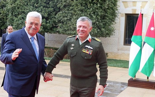 Jordan's King Abdullah II (R) welcomes Palestinian Authority President Mahmoud Abbas to the Royal Palace in Amman on January 29, 2018. (AFP Photo/Khalil Mazraawi) Jordan's King Abdullah II (R) welcomes Palestinian Authority President Mahmoud Abbas to the Royal Palace in Amman on January 29, 2018. (AFP Photo/Khalil Mazraawi)