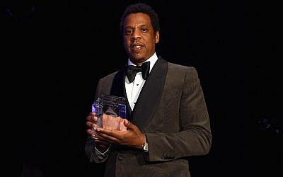 Honoree Jay-Z accepts the President's Merit Award onstage during the Clive Davis and Recording Academy Pre-GRAMMY Gala and GRAMMY Salute to Industry Icons Honoring Jay-Z, on January 27, 2018, in New York City.   (Michael Kovac/Getty Images for NARAS/AFP)