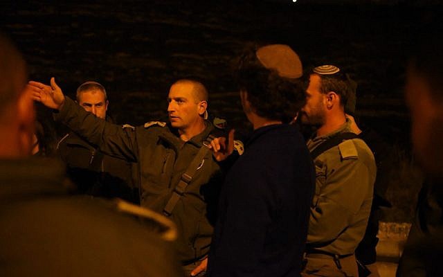 The head of the army's northern West Bank's Samaria Brigade speaks with officers and soldiers after a terror attack in the area on January 10, 2018. (Israel Defense Forces) The head of the army's northern West Bank's Samaria Brigade speaks with officers and soldiers after a terror attack in the area on January 10, 2018. (Israel Defense Forces)
