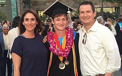 Blaze Bernstein, center, with his parents, Jeanne Pepper and Gideon Bernstein. (Facebook via JTA)