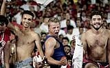 In this October 8, 2017 photo, Egyptian fans celebrate after beating Congo during the 2018 World Cup group E qualifying soccer match at the Borg El Arab Stadium in Alexandria, Egypt. (AP Photo/Nariman El-Mofty)