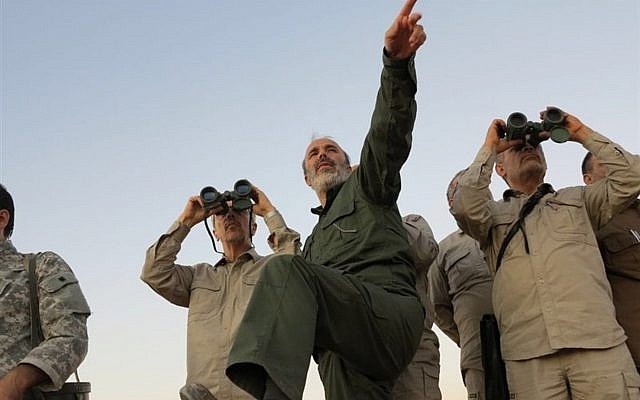 This October. 20, 2017 file photo, by the government-controlled Syrian Central Military Media, shows Iran's Army Chief of Staff Maj. Gen. Mohammad Bagheri with binoculars, as he visits senior Iranian military officers in the northern province of Aleppo, Syria. (Syrian Central Military Media, via AP) This October. 20, 2017 file photo, by the government-controlled Syrian Central Military Media, shows Iran's Army Chief of Staff Maj. Gen. Mohammad Bagheri with binoculars, as he visits senior Iranian military officers in the northern province of Aleppo, Syria. (Syrian Central Military Media, via AP)