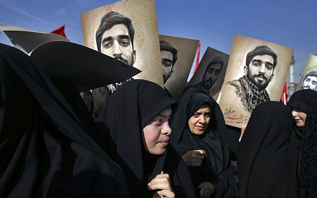 In this Sept. 27, 2017 file photo, thousands attend the state funeral of Mohsen Hojaji, a young Revolutionary Guard soldier beheaded in Syria by the Islamic State group, in Tehran, Iran. (AP Photo/Ebrahim Noroozi) In this Sept. 27, 2017 file photo, thousands attend the state funeral of Mohsen Hojaji, a young Revolutionary Guard soldier beheaded in Syria by the Islamic State group, in Tehran, Iran. (AP Photo/Ebrahim Noroozi)