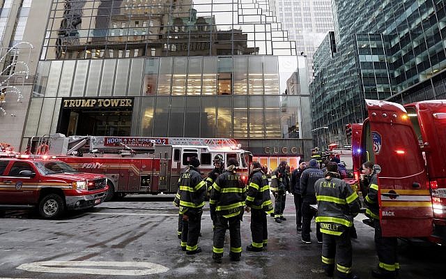 New York City Fire Department vehicles sit on Fifth Avenue in front of Trump Tower, in New York, on January 8, 2018. (AP Photo/Richard Drew)