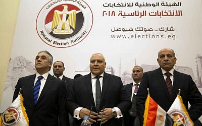 Lasheen Ibrahim, head of the National Electoral Commission, which is in charge of supervising the 2018 Egyptian presidential election, center, and members of the commission prepare to give a press conference at the commission headquarters in Cairo, Egypt, January 8, 2018. (AP Photo/Amr Nabil)