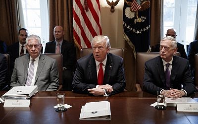 Secretary of State Rex Tillerson, left, and Secretary of Defense Jim Mattis, right, listen as President Donald Trump speaks during a cabinet meeting at the White House, January 10, 2018, in Washington. (AP Photo/Evan Vucci)