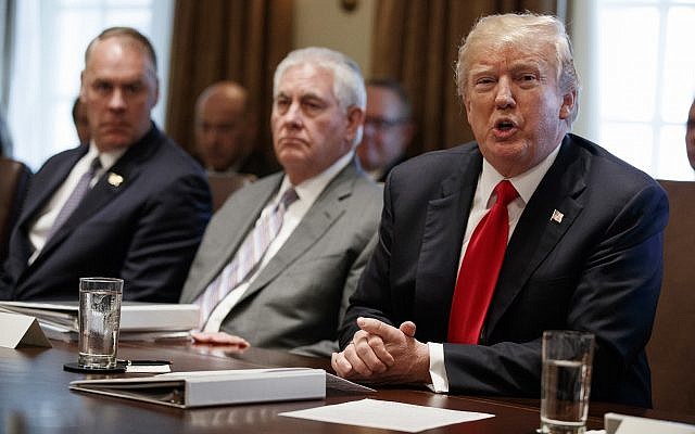 US President Donald Trump speaks during a cabinet meeting at the White House, Wednesday, Jan. 10, 2018, in Washington. From left, Secretary of Interior Ryan Zinke, Secretary of State Rex Tillerson, and Trump. (AP Photo/Evan Vucci) US President Donald Trump speaks during a cabinet meeting at the White House, Wednesday, Jan. 10, 2018, in Washington. From left, Secretary of Interior Ryan Zinke, Secretary of State Rex Tillerson, and Trump. (AP Photo/Evan Vucci)