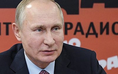Russian President Vladimir Putin speaks during a meeting with Russian journalists in the office of Russian popular newspaper Komsomolskaya Pravda in Moscow, Russia, Thursday, Jan. 11, 2018. (Alexei Druzhinin, Sputnik, Kremlin Pool Photo via AP)