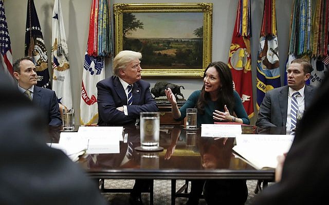 US President Donald Trump looks toward Brooke Rollins, president and CEO of the Texas Public Policy Foundation, as she speaks during a prison reform roundtable in the White House, January 11, 2018. (AP/Carolyn Kaster) US President Donald Trump looks toward Brooke Rollins, president and CEO of the Texas Public Policy Foundation, as she speaks during a prison reform roundtable in the White House, January 11, 2018. (AP/Carolyn Kaster)