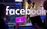 Conference workers speak in front of a demo booth at Facebook's annual F8 developer conference in San Jose, California, April 18, 2017. (AP/Noah Berger)