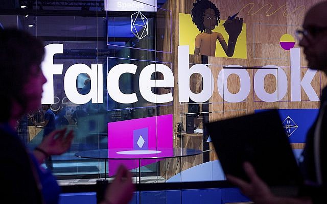Conference workers speak in front of a demo booth at Facebook's annual F8 developer conference in San Jose, California, April 18, 2017. (AP/Noah Berger) Conference workers speak in front of a demo booth at Facebook's annual F8 developer conference in San Jose, California, April 18, 2017. (AP/Noah Berger)