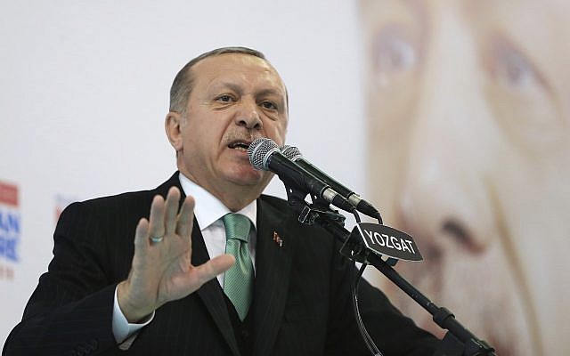 Turkey's President Recep Tayyip Erdogan talks to supporters of his ruling Justice and Development Party at a rally in Yozgat, Turkey,on January 14, 2018. (Pool Photo via AP) Turkey's President Recep Tayyip Erdogan talks to supporters of his ruling Justice and Development Party at a rally in Yozgat, Turkey,on January 14, 2018. (Pool Photo via AP)