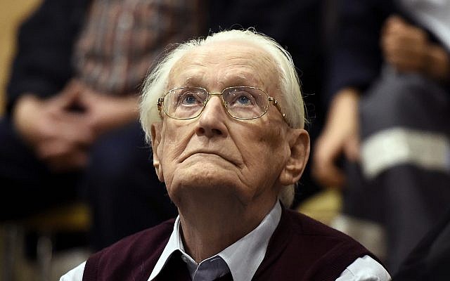 Former SS sergeant Oskar Groening looks up, as he listens to the verdict of his trial at a court in Lueneburg, Germany, on July 15, 2015. (Tobias Schwarz/Pool Photo via AP, File) Former SS sergeant Oskar Groening looks up, as he listens to the verdict of his trial at a court in Lueneburg, Germany, on July 15, 2015. (Tobias Schwarz/Pool Photo via AP, File)