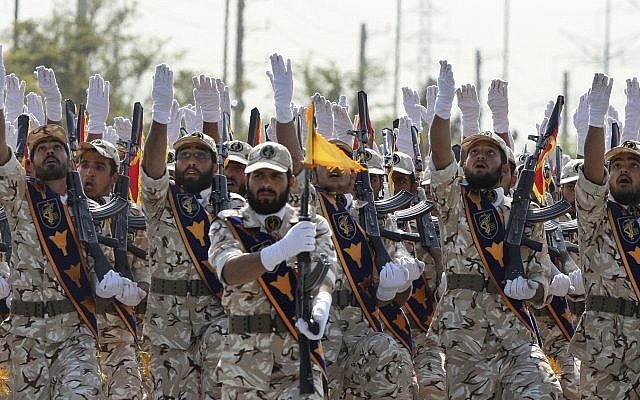 Iran's Revolutionary Guard members march during an armed forces parade marking the anniversary of the start of the 1980-88 Iraq-Iran war, in front of the shrine of the late revolutionary founder Ayatollah Khomeini, just outside Tehran, Iran, on September 22, 2011. (AP Photo/Vahid Salemi, File) Iran's Revolutionary Guard members march during an armed forces parade marking the anniversary of the start of the 1980-88 Iraq-Iran war, in front of the shrine of the late revolutionary founder Ayatollah Khomeini, just outside Tehran, Iran, on September 22, 2011. (AP Photo/Vahid Salemi, File)