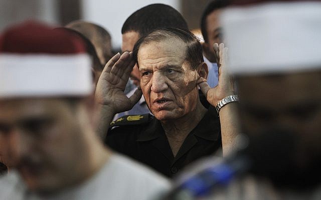 Then-Egyptian armed forces chief of staff Sami Annan performs prayers for 16 Egyptian soldiers who were killed, in Cairo, Egypt, August 5, 2012. (AP Photo/Amr Nabil, File) Then-Egyptian armed forces chief of staff Sami Annan performs prayers for 16 Egyptian soldiers who were killed, in Cairo, Egypt, August 5, 2012. (AP Photo/Amr Nabil, File)