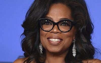 In this file photo from January 7, 2018, Oprah Winfrey poses in the press room with the Cecil B. DeMille Award at the 75th annual Golden Globe Awards in Beverly Hills, California. (Jordan Strauss/Invision/AP, File)